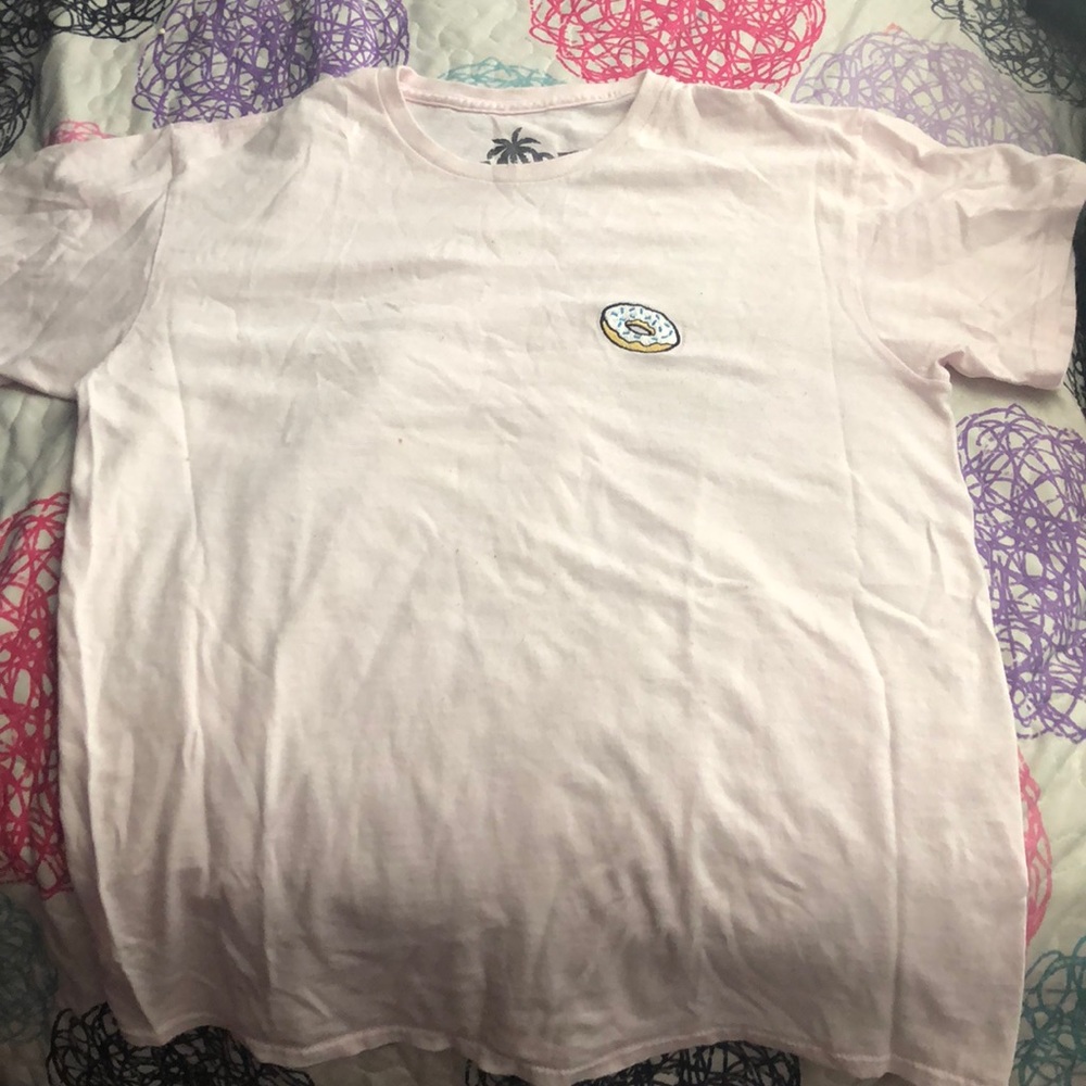 pink oversized shirt with a pastel blue donut